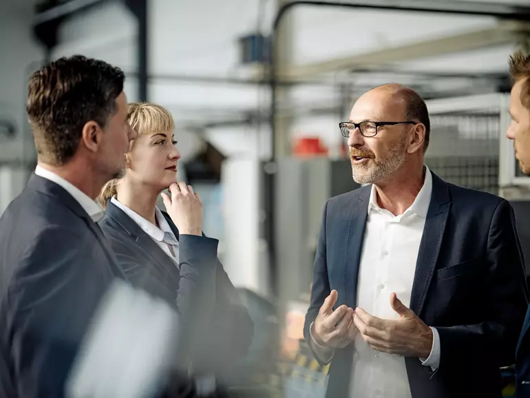 Business team having a meeting in a factory