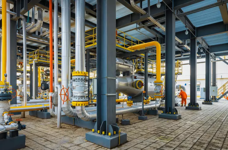 Interior of chemical complex showing oil pipes