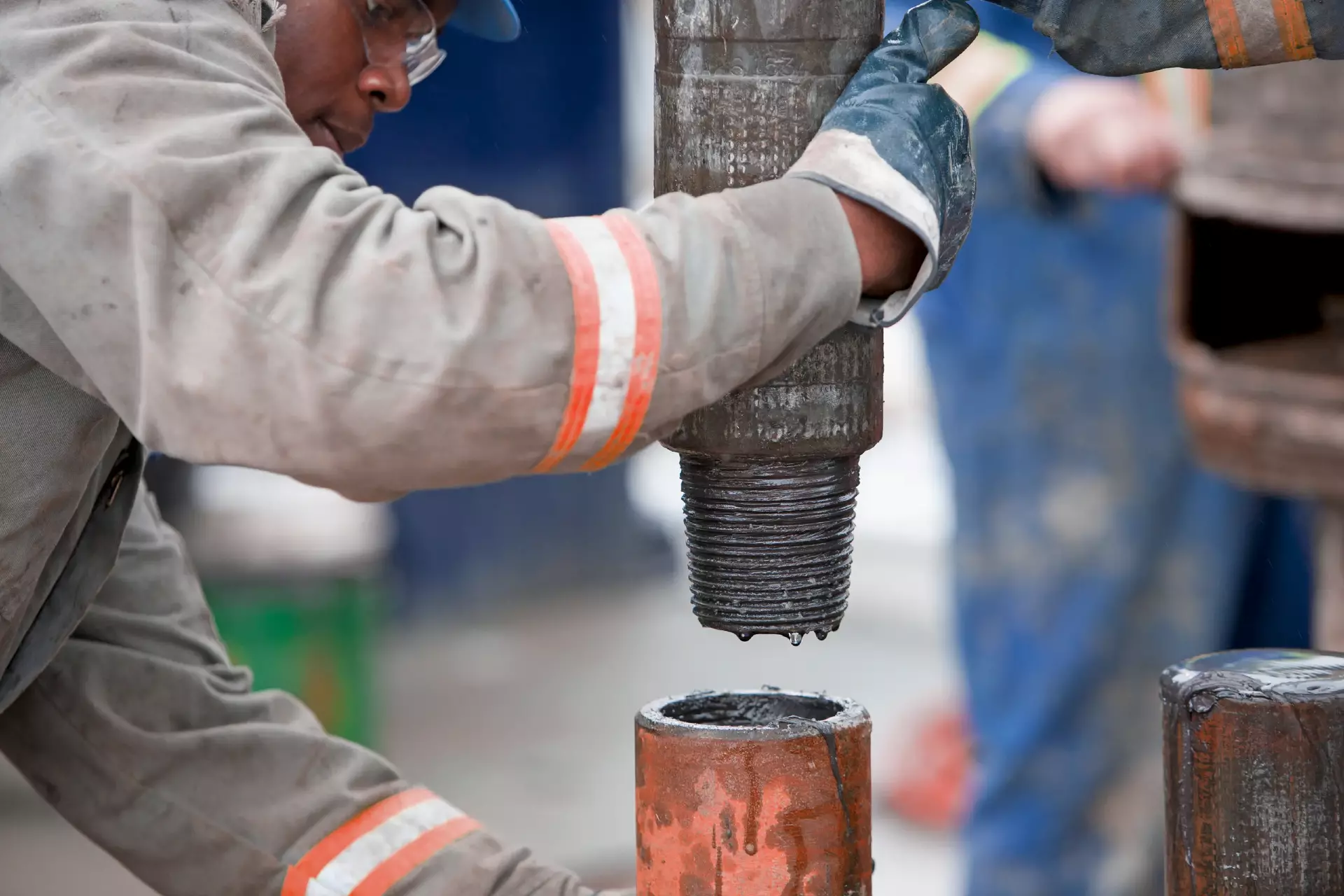 Oil worker drilling for oil on rig