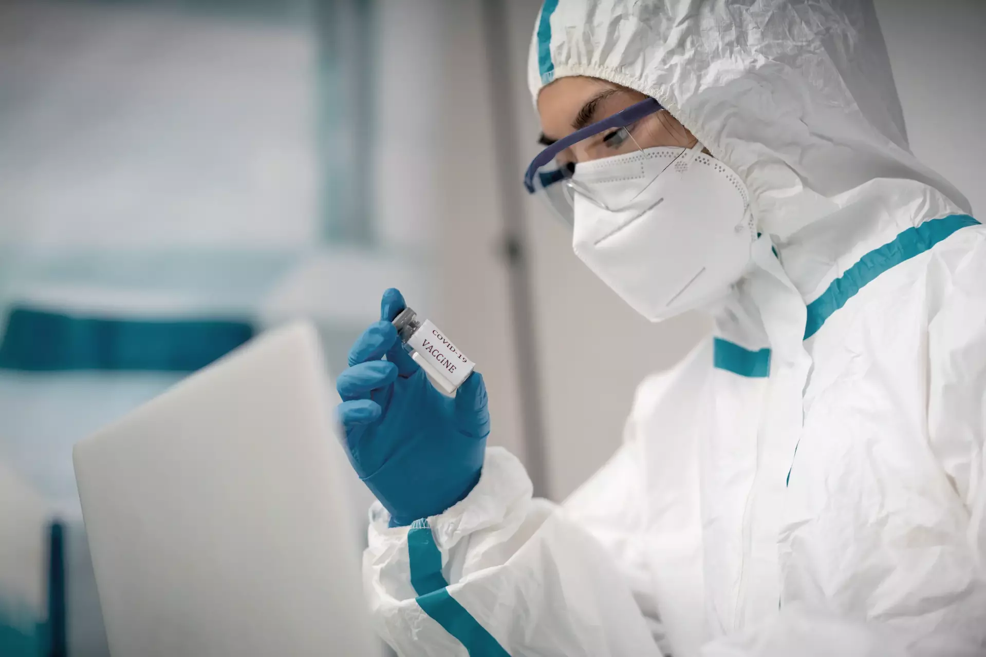 A doctor examines the novel coronavirus vaccine