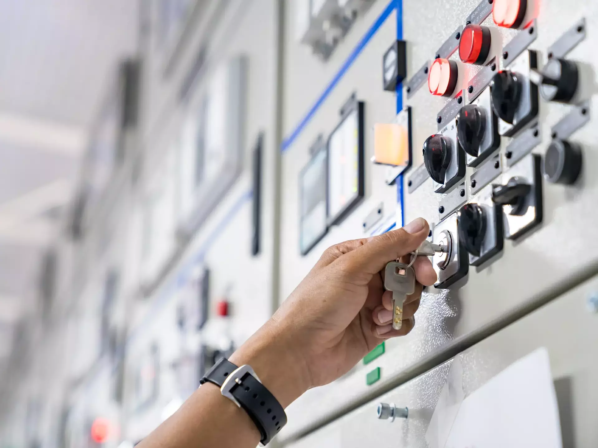 Engineer hand unlock the key to mainenance checking switchgear
