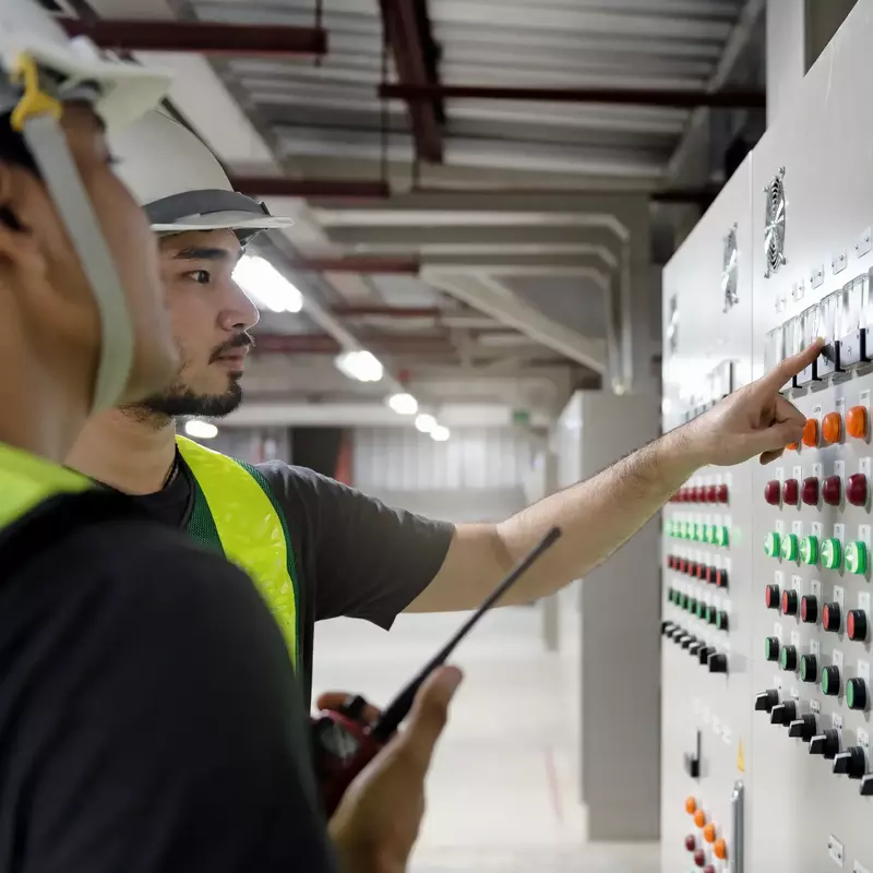 Electrical engineer team working on control panels