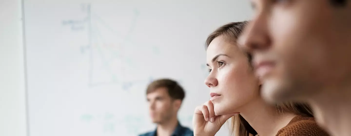 Student listening in college classroom