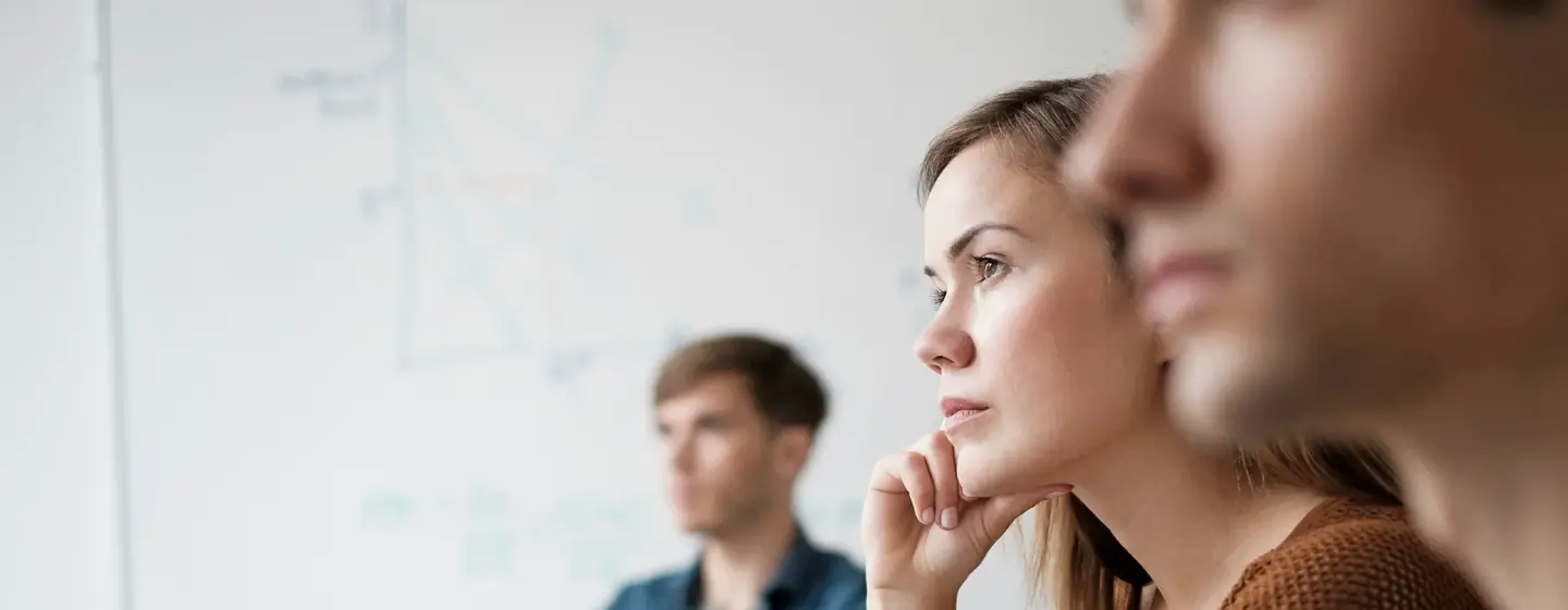 Student listening in college classroom