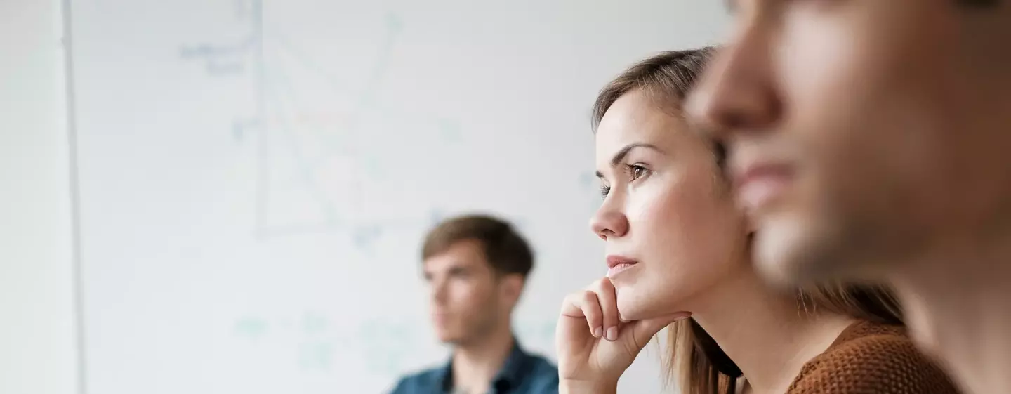 Student listening in college classroom
