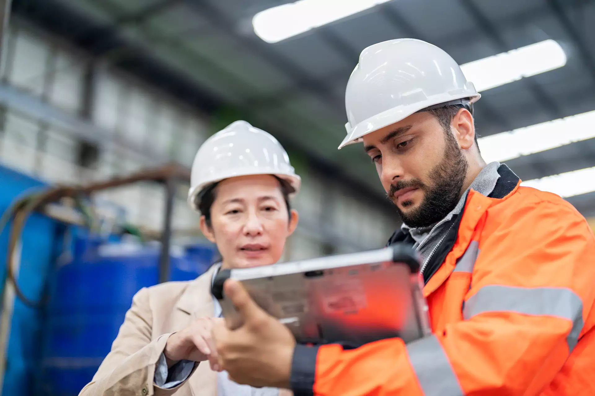 Engineer and manager discussing work plan at factory