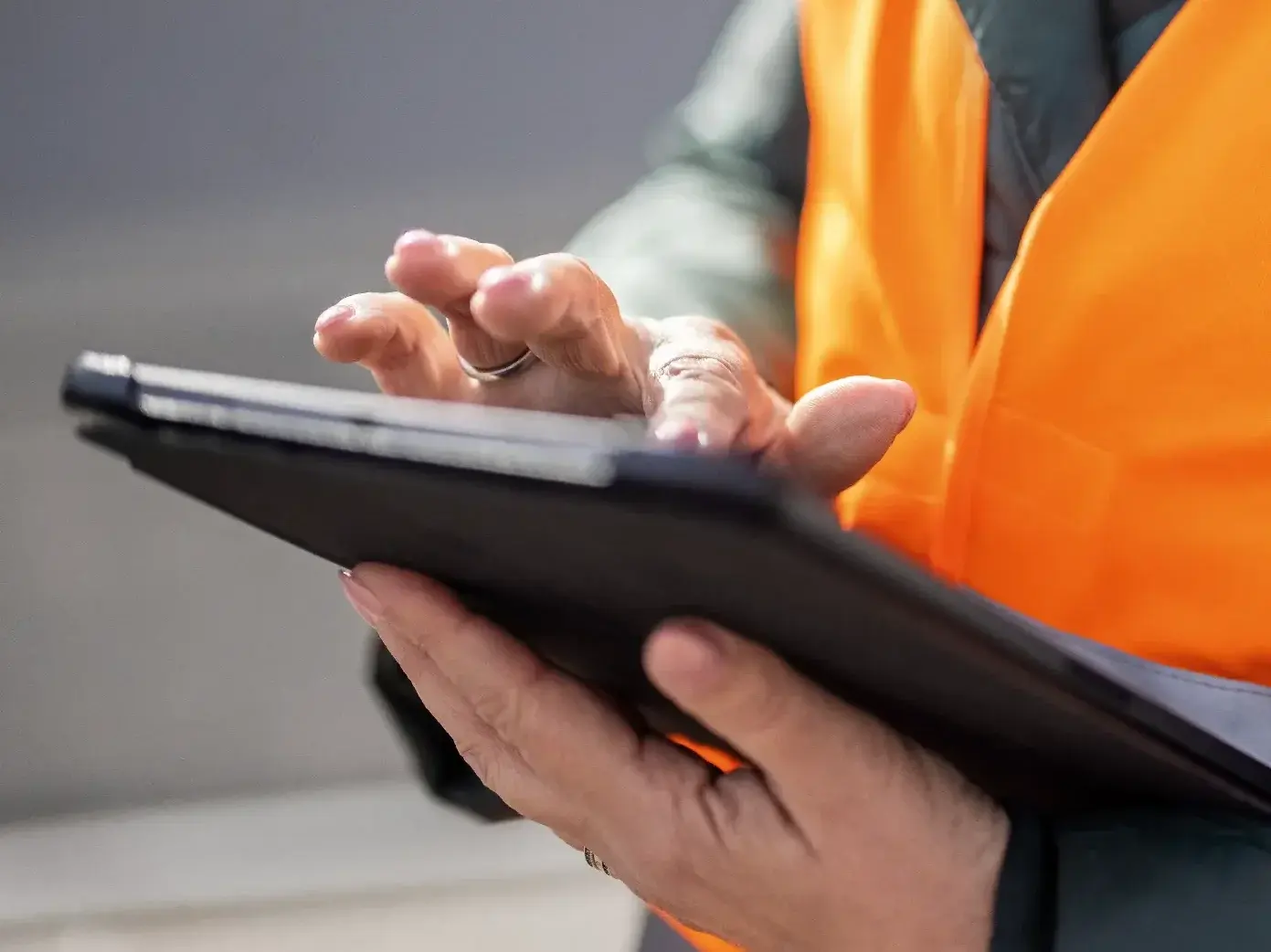 Close up of a commercial dock manager using digital tablet