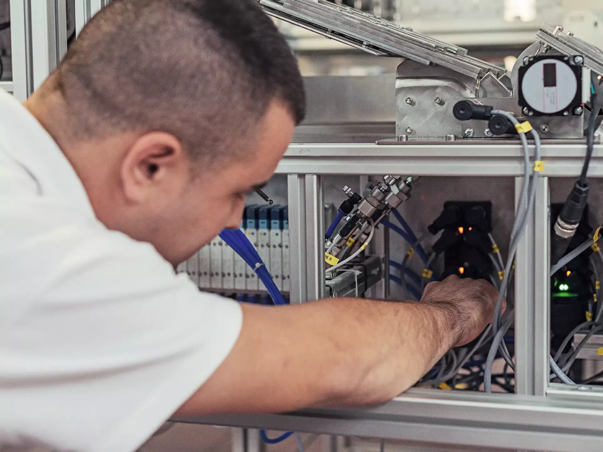 Repairman working with broken production line machine