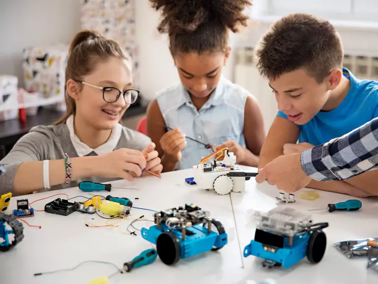 Kids working on a robot design